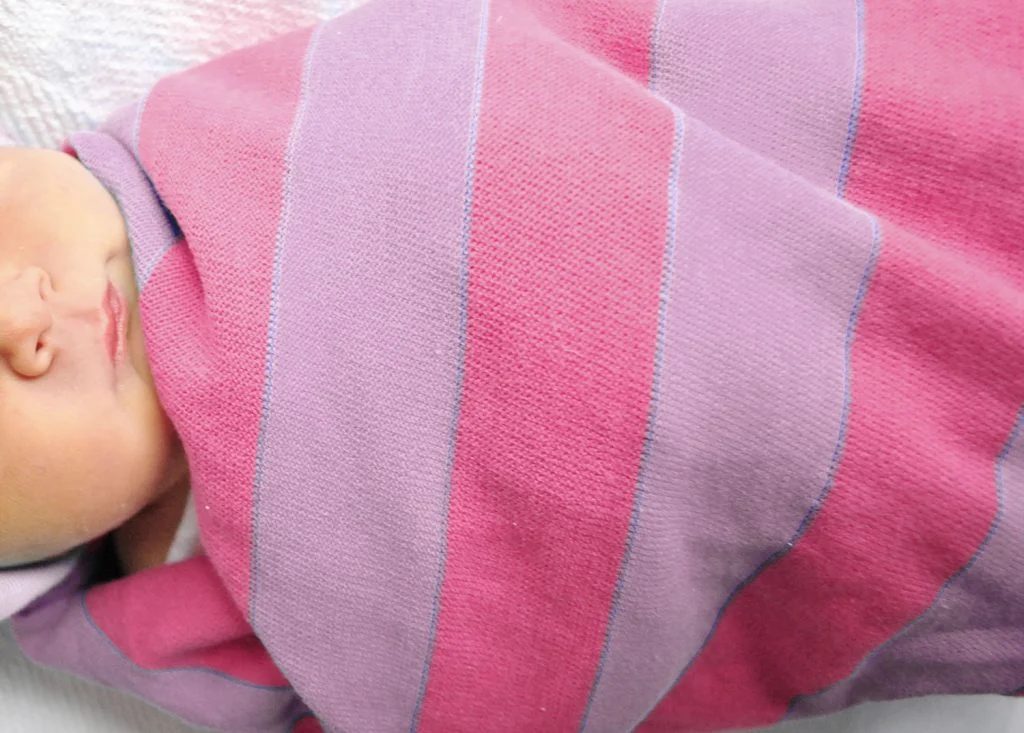 Pink Purple Baby Girl Blanket Wrapped Around Newborn