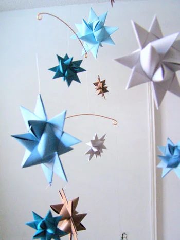 A Baby Boy’s Nursery Alongside Blue Paint And Floating Shelves