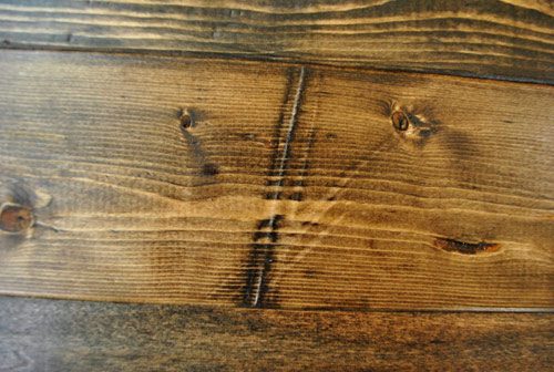 what long dent brought in to new wood looks like after staining with medium wood stain