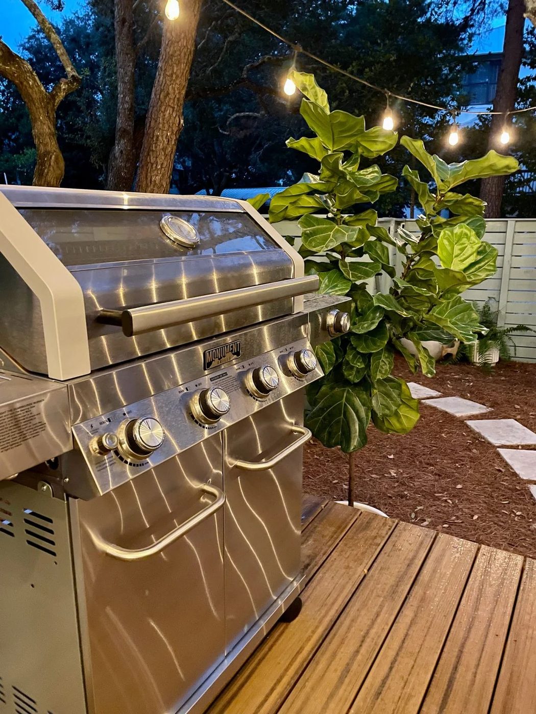 Detail photo of stainless steel grill at night