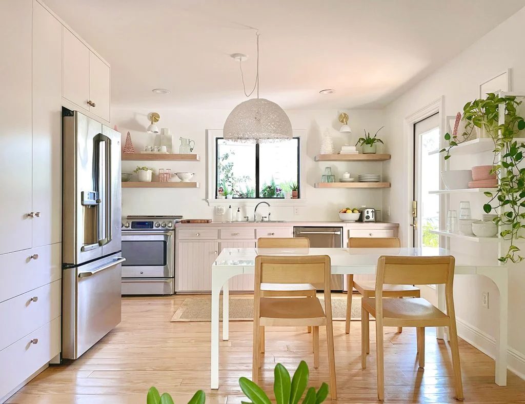 Small Kitchen With White And Mauve Cabinets With Plants