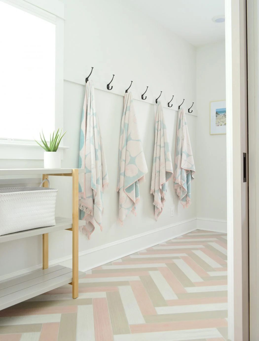 Hanging Towel Hook Storage In Duplex Mudroom With Herringbone Tile Floors