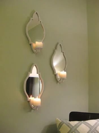 Hanging 3 Candle Sconces On The Bedroom Wall: a house log