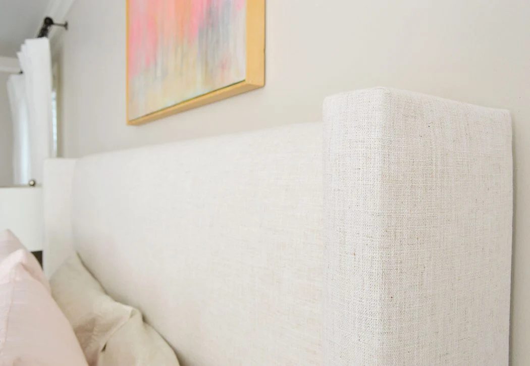 detail on upholstered bed with linen texture
