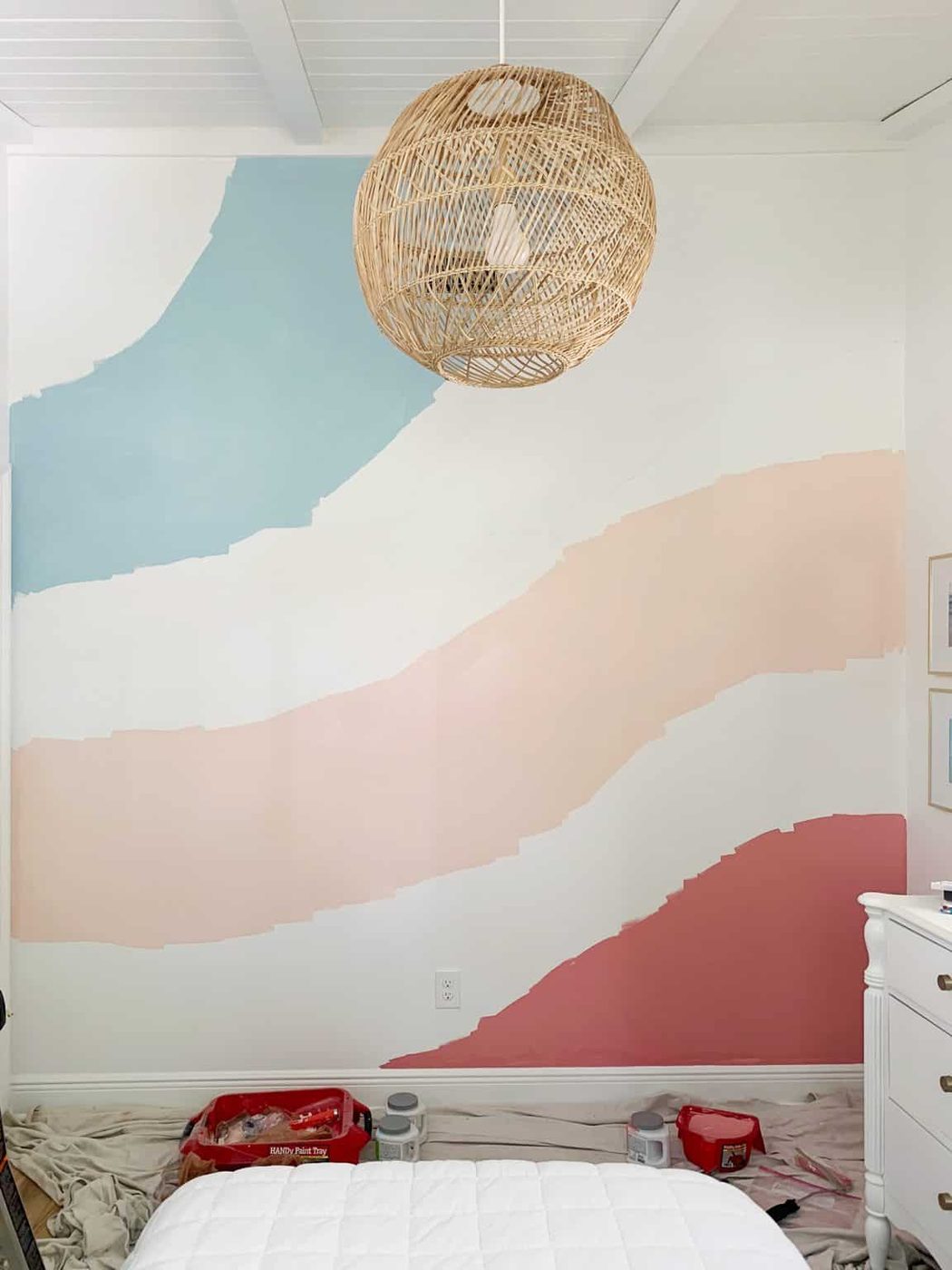 First three stripes painted in abstract wall mural in girls room.
