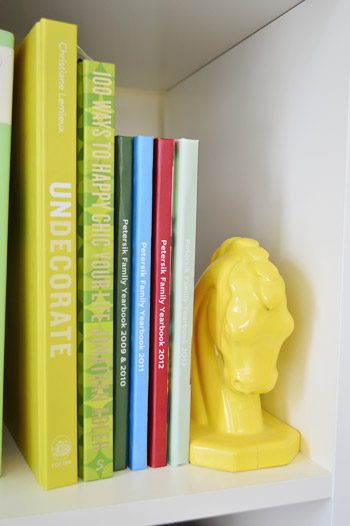 Stack of Family Yearbook Photo Books on Shelf