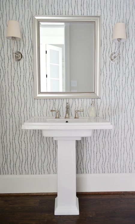 Pedestal Sink In Bathroom With Floor To Ceiling Decorative Marble Modern Tile