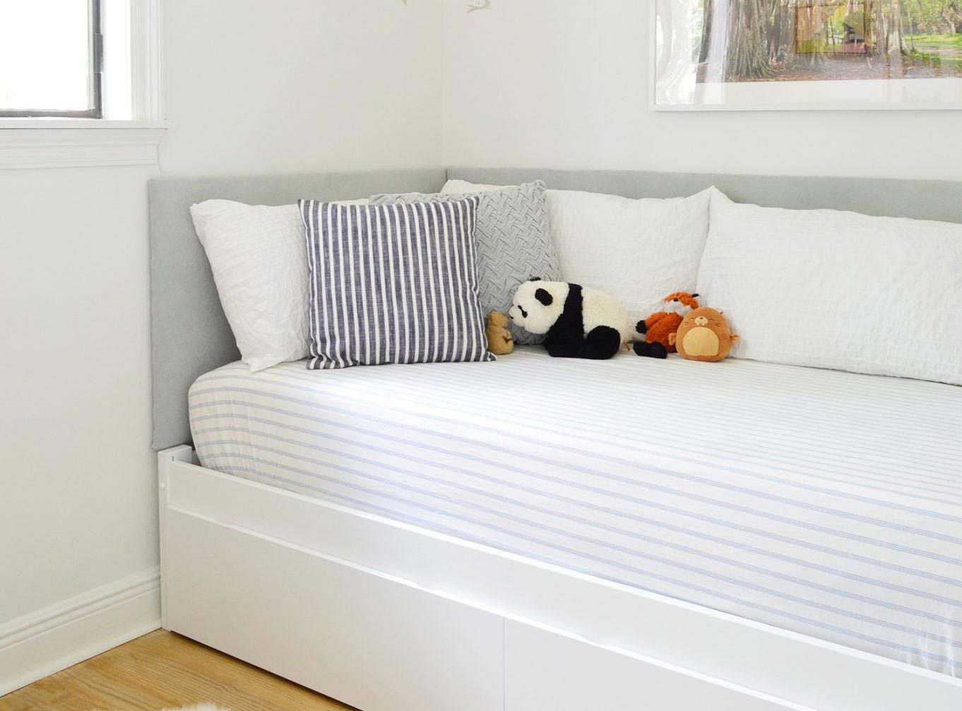Custom Hands-on Bookshelf At Foot Of Boys Room Daybed With Upholstered Headboard