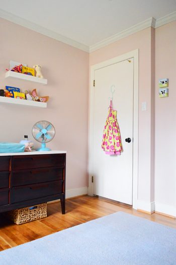 pink girl's bedroom with crown molding on ceiling