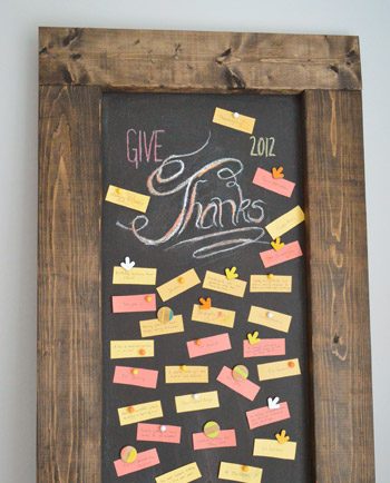 Leaning Hands-on magnetic chalkboard with Give Thanks lettering in chalk with gratitude notes
