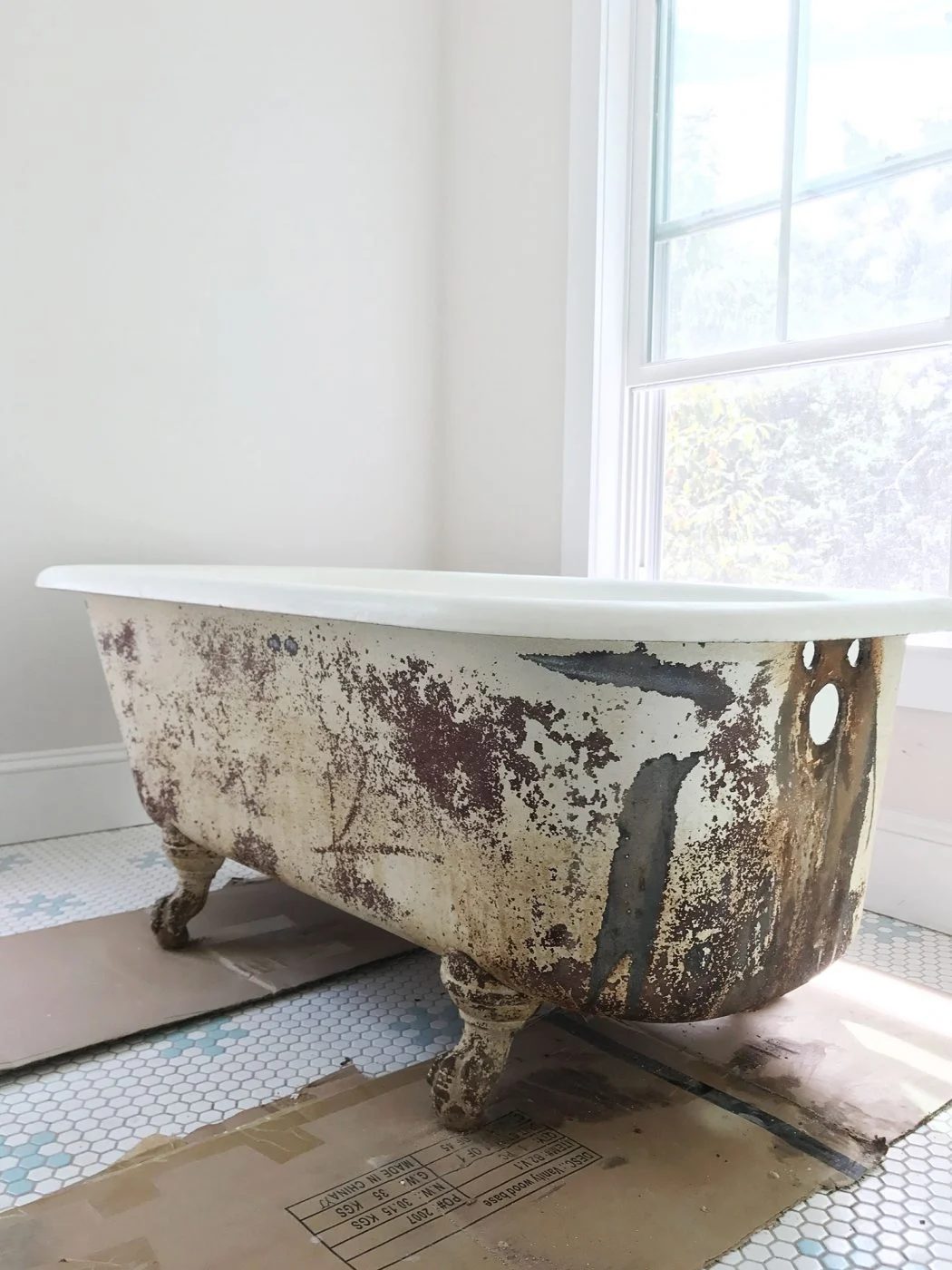 Rust took out from the outside of an old clawfoot tub