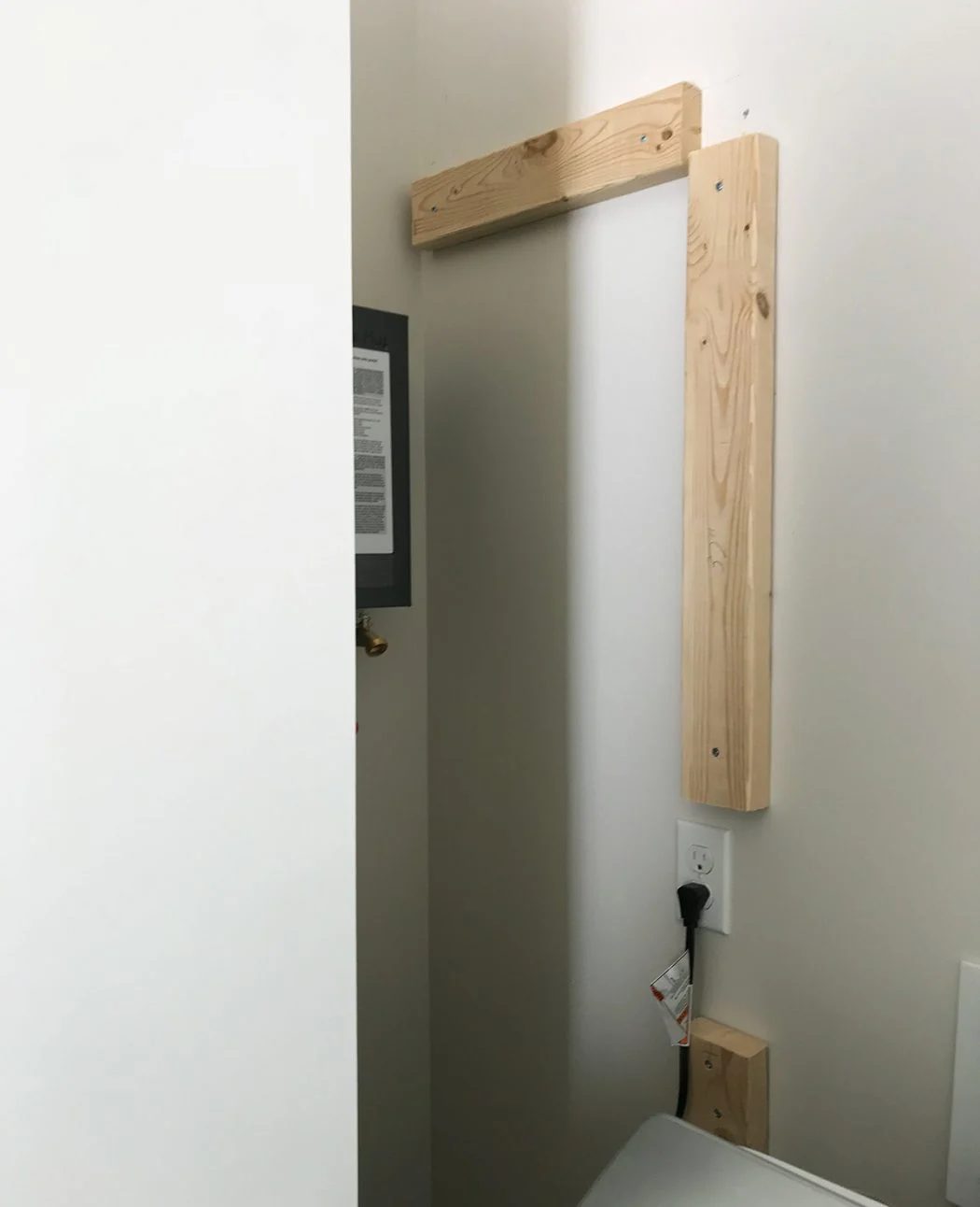 2x4 board brought in to back wall for nailing plywood panel into