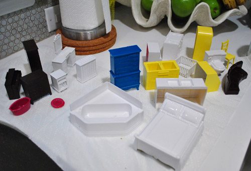 Wrapped up Assortment Of Painted Plastic Dollhouse Furniture