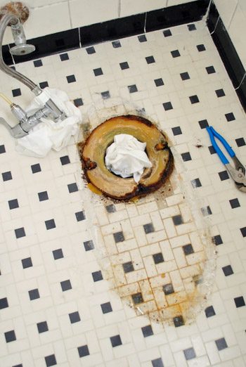 Old wax ring around toilet flange after toilet was took out from bathroom floor