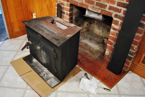 Removing An Old Woodstove Fireplace Insert: a house log