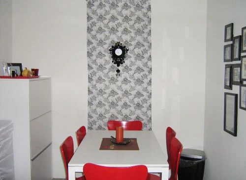 Kitchen Makeover Alongside Red Chairs And Fabric On The Wall