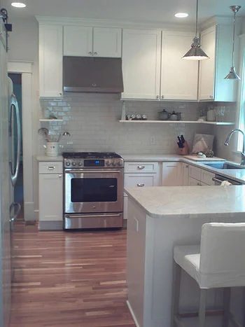 A Classic White Kitchen Alongside Subway Tile