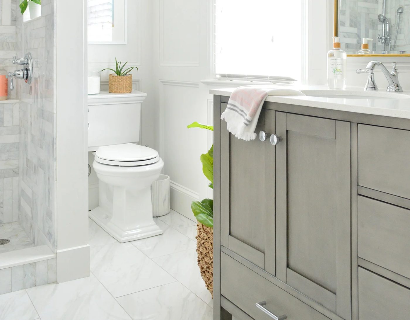 Kohler Memoirs Toilet In Marble Bathroom With Wall Molding