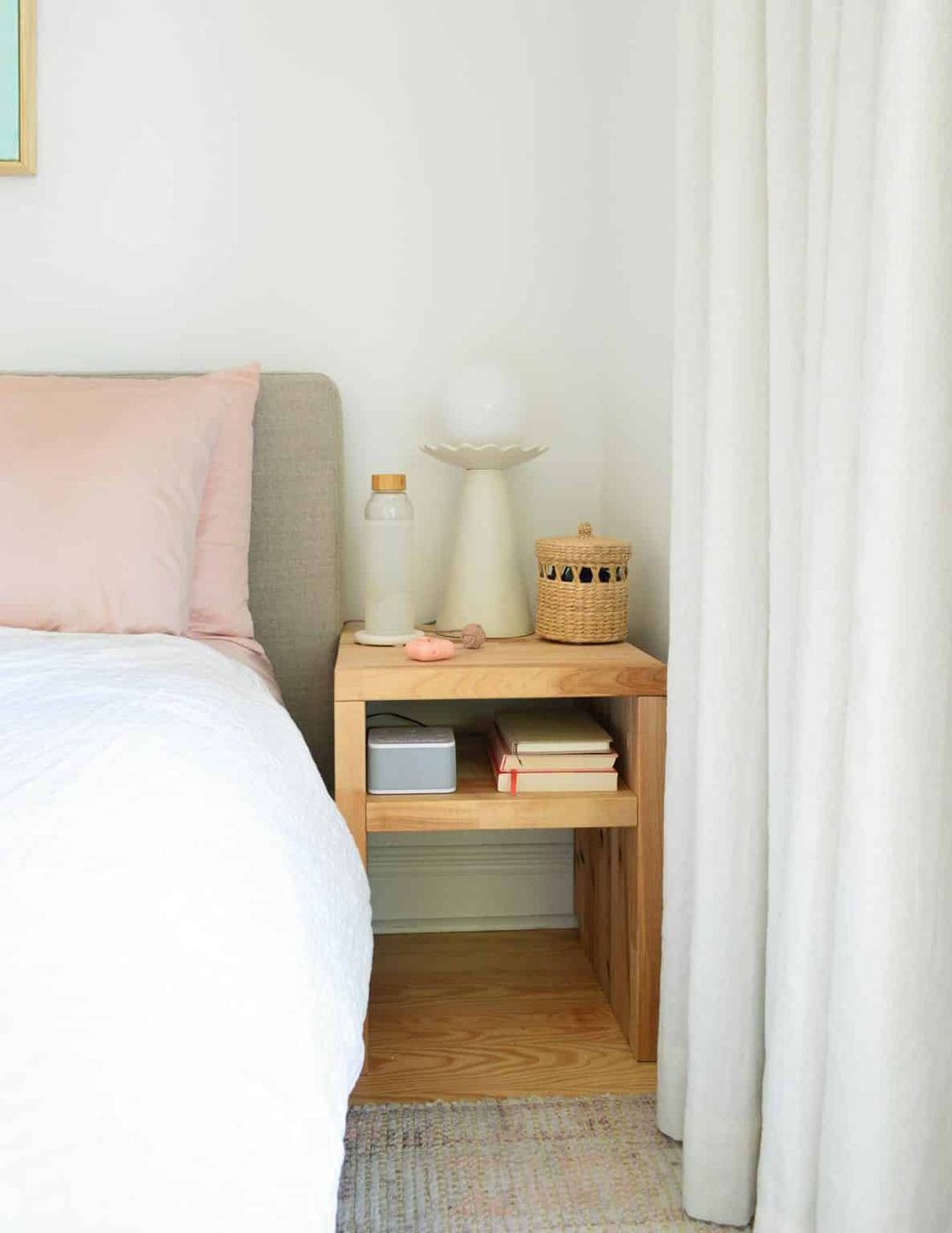 Small Wood Butcher Block Hands-on Nightstand With Modern Lamp And Curtain