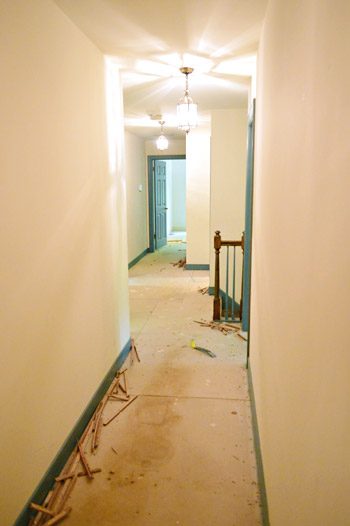 subfloor in hallway with carpet took out