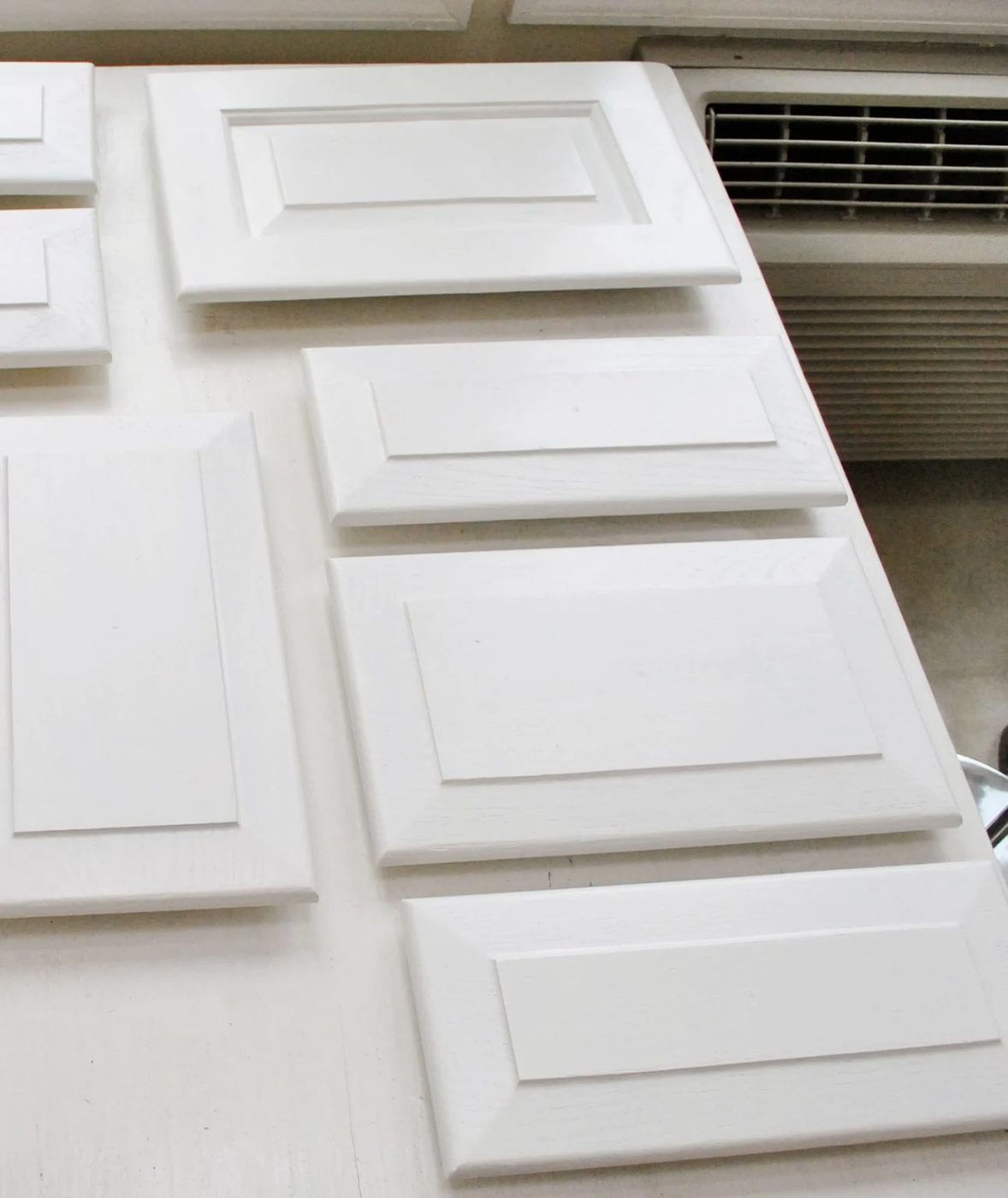 White Painted Kitchen Cabinet Doors Laid Out