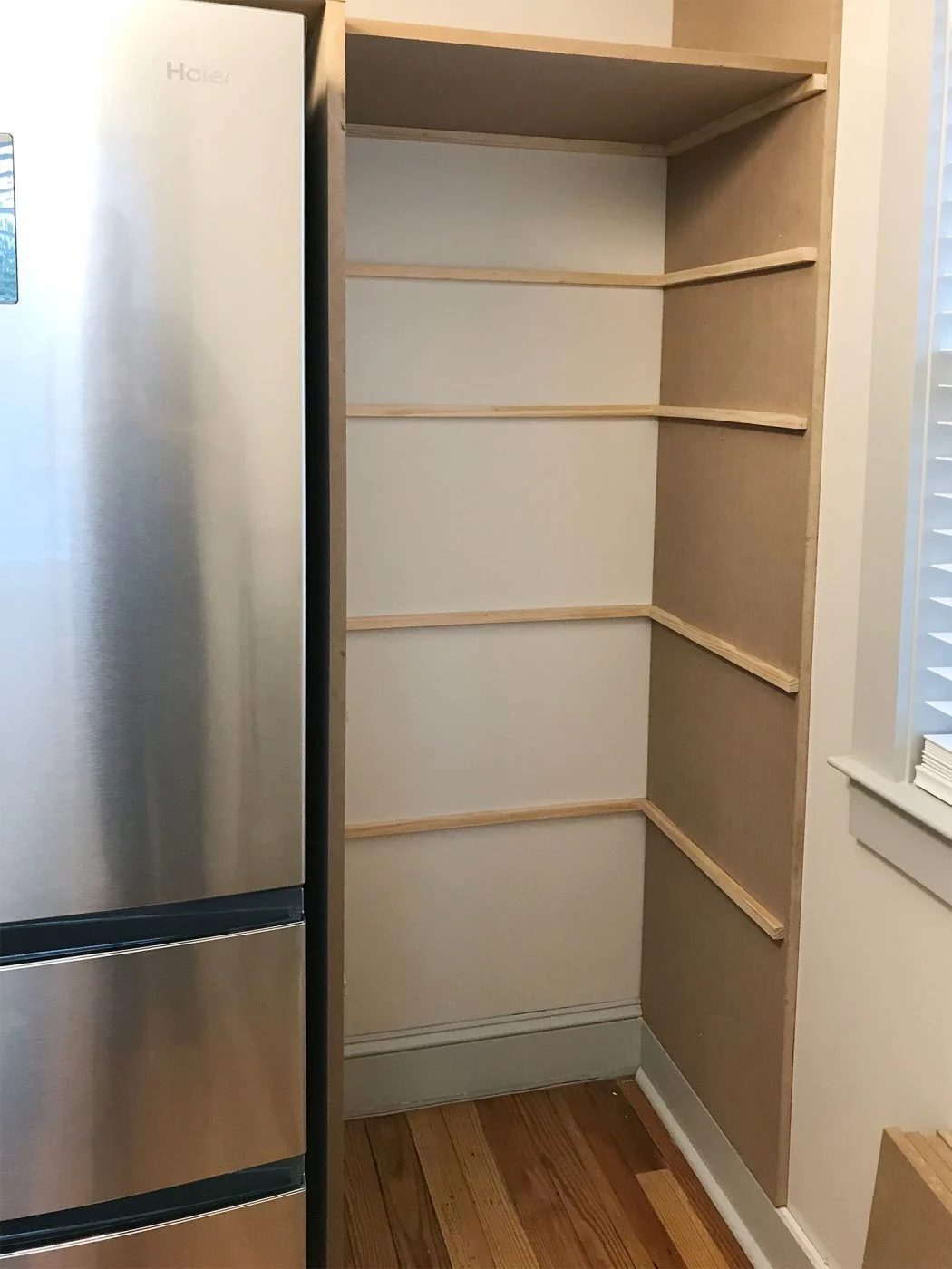 thin brace pieces brought in where pantry shelves will rest