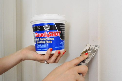 applying DAP CrackShot High Performance Spackling Paste to fill nail holes in wood Hands-on project