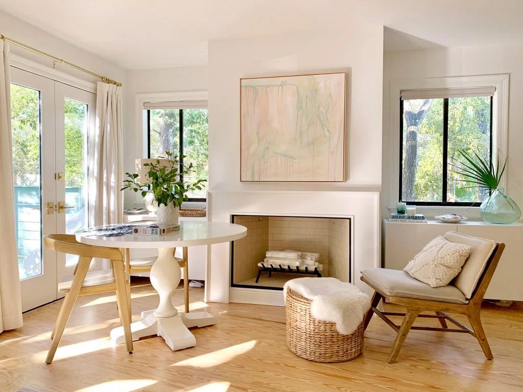 Seating area in bedroom in front of fireplace with Hands-on mantle