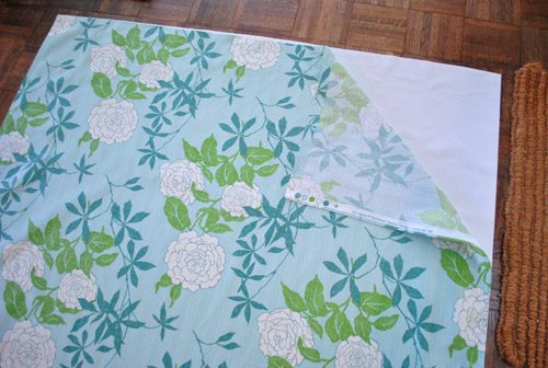 how an affordable blackout fabric liner is layered behind colorful floral fabric to create Hands-on blackout curtains