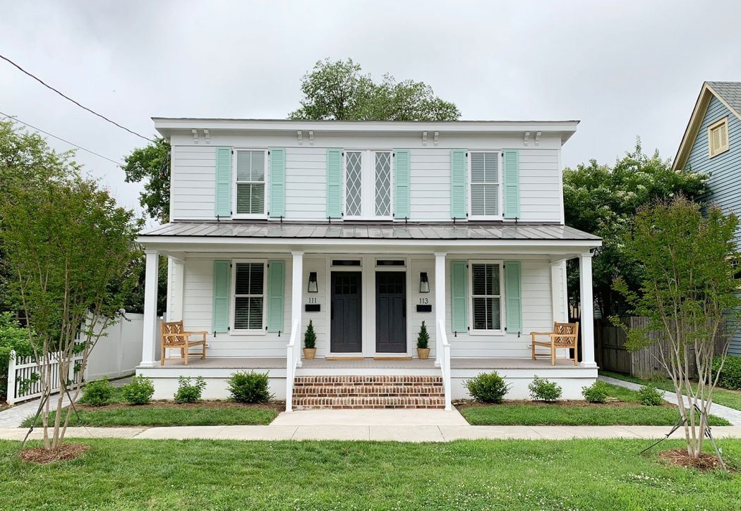 Wide Angle of Wrapped up Duplex With Diamond Windows Pale Patina Shutters And Open Proch
