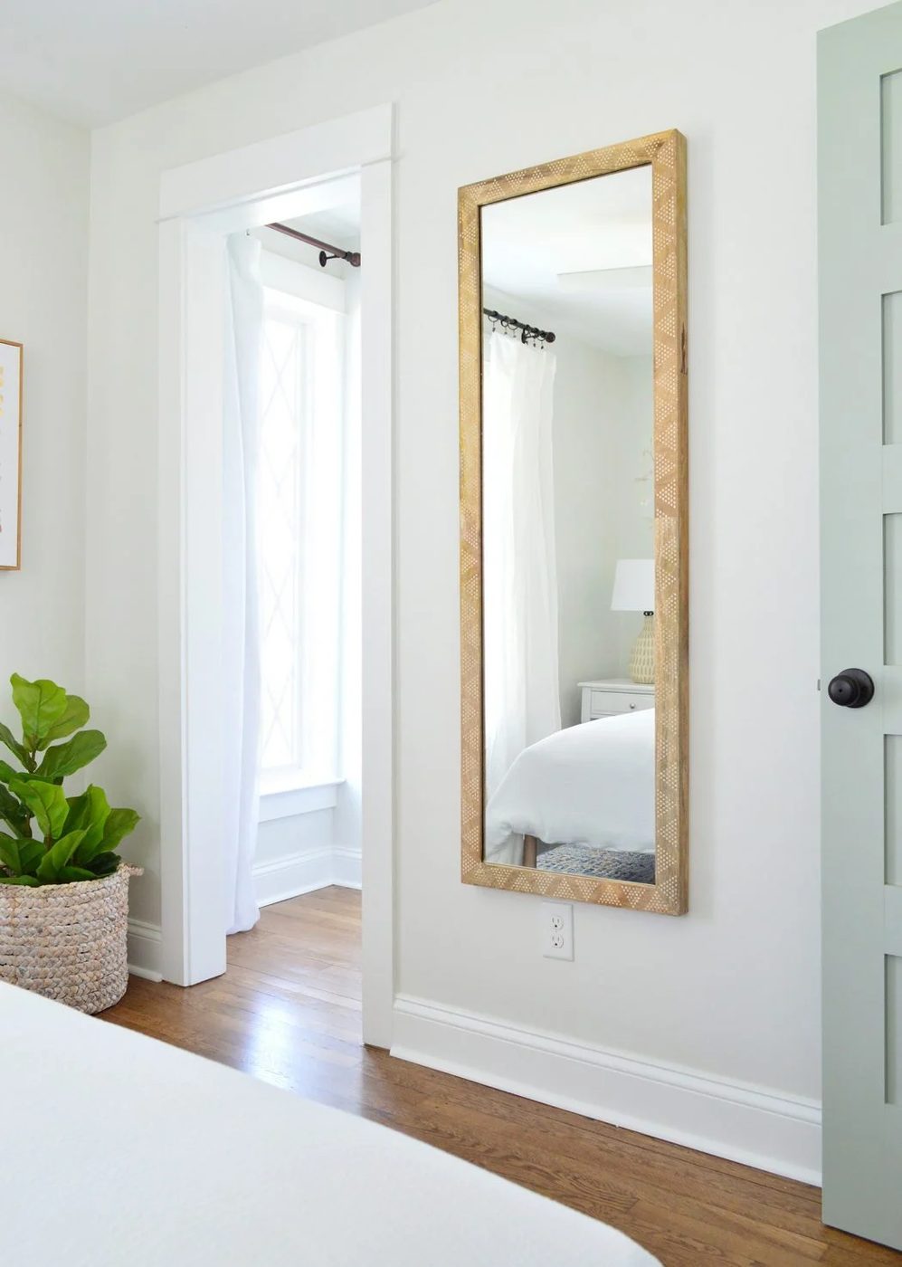 Front Bedroom On Other Side With Wood Patterned Mirror and Blue Oyster Bay Door