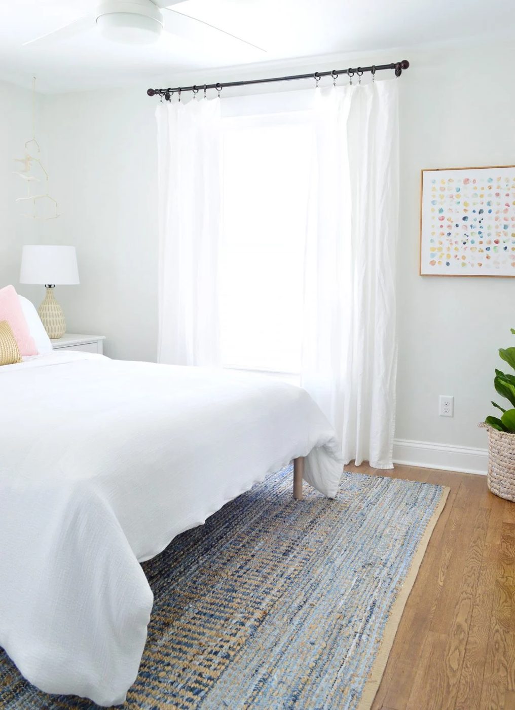 After Of Front Bedroom With Blue Rug And White Curtains And Bedding
