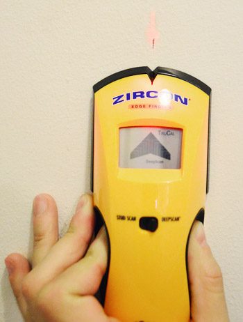 using a Zircon digital stud finder to locate stud within a wall for Hands-on project