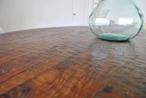 A Round Wood Pedestal Dining Table: a house log