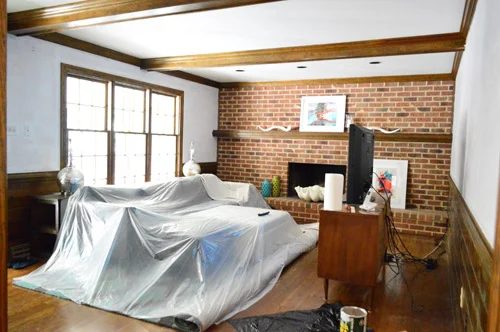 Priming A Bright Wall Before Painting: a house log