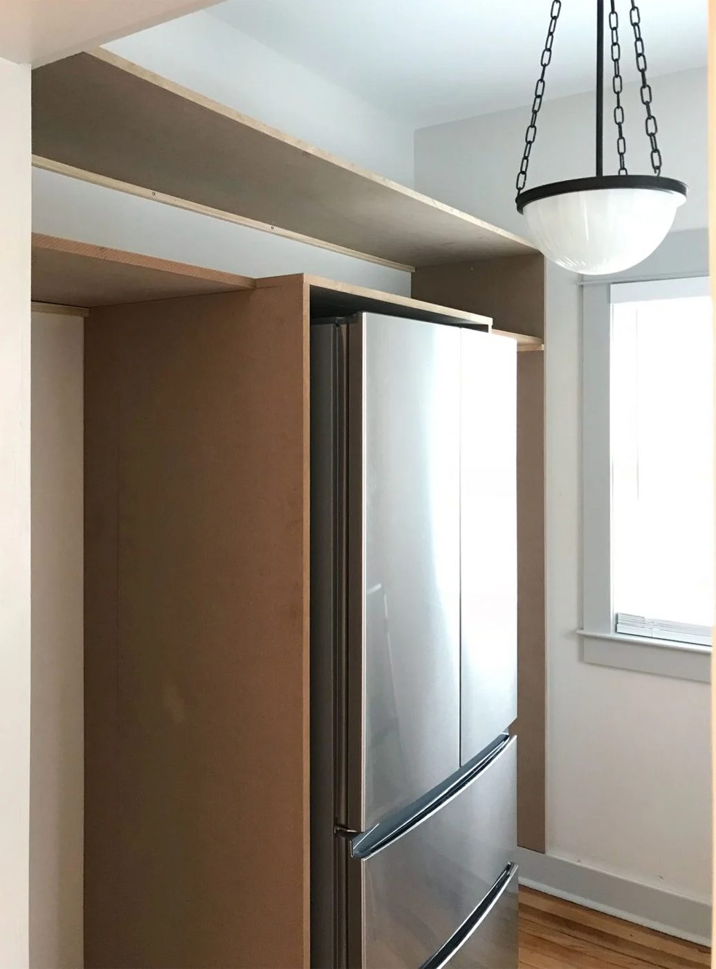 two long horizontal pantry shelves brought in on top of vertical pieces