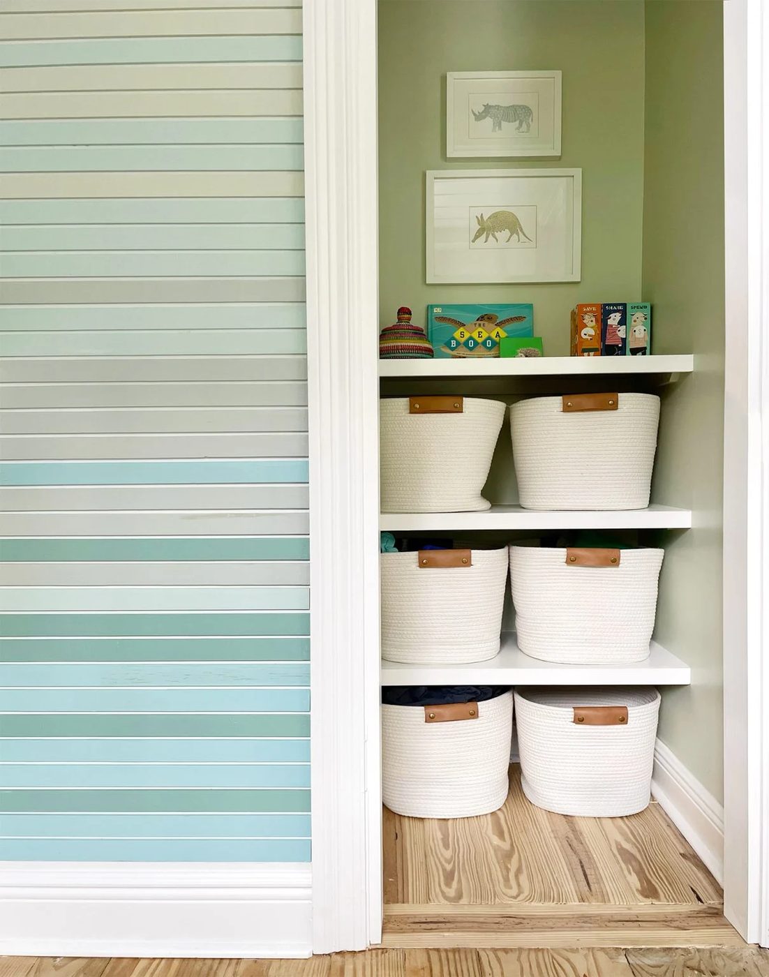Painted Closet With Custom Hands-on Shelves And Art Hanging Above Them