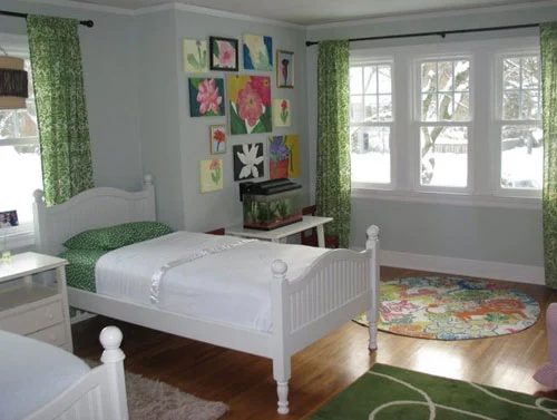 A Cheerful Kids Room Alongside Two Twin Beds
