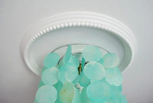 Covering Drywall Cracks Alongside A Ceiling Medallion