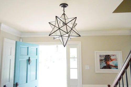 Hanging A Moravian Star Light In The Foyer: a house log