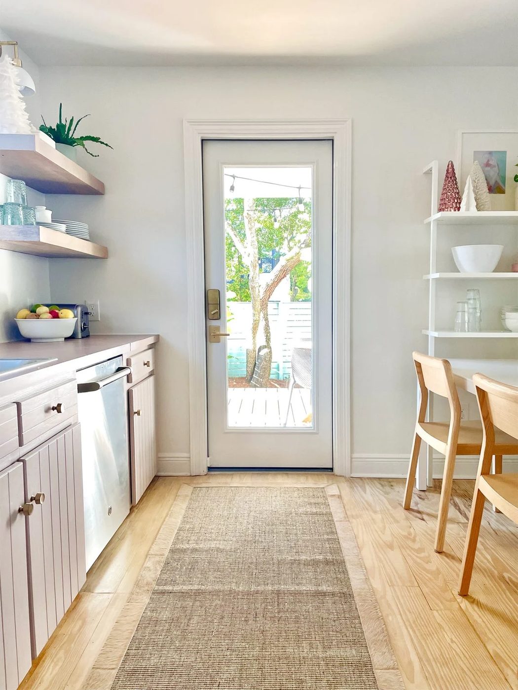 Same view of kitchen with new door brought in where window used to be