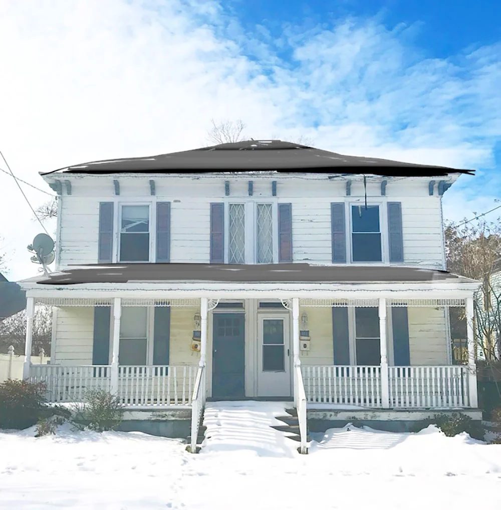 Before photo of historic home in Cape Charles Virginia in snow with roof