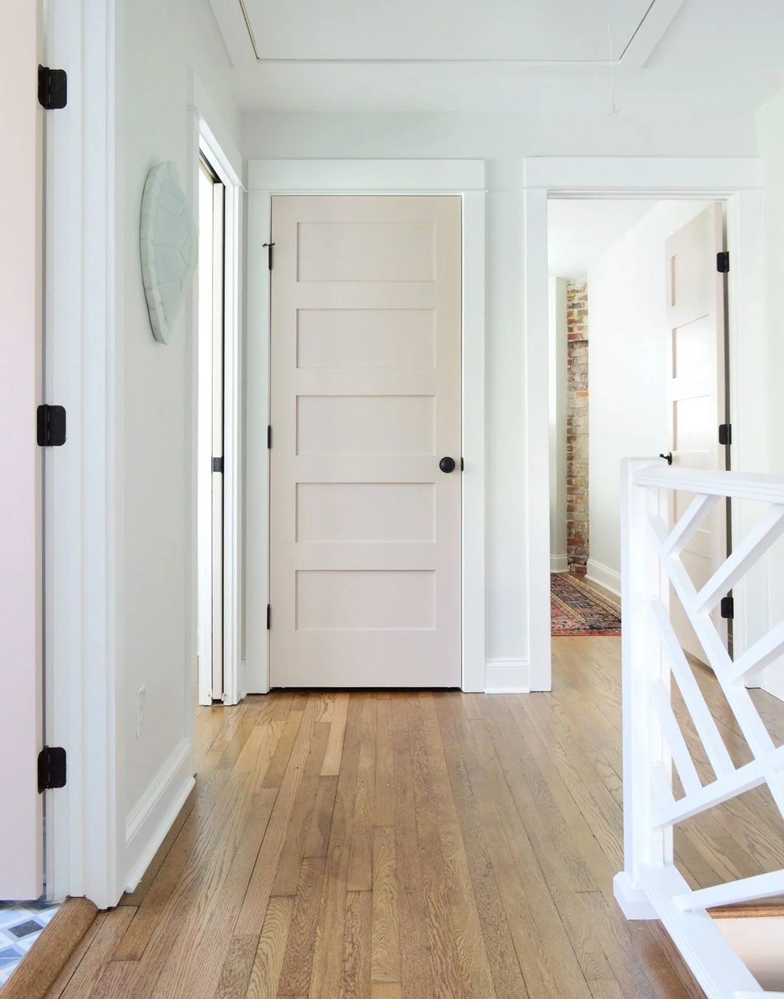 Hallway Upstairs Landing With Pink Doors And Extra White Trim