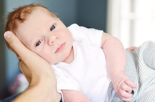 Hands-on Newborn Photo Shoot Portrait With Eyes Open