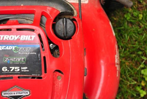 Cleaning An Oil-Clogged Air Filter In The Lawn Mower
