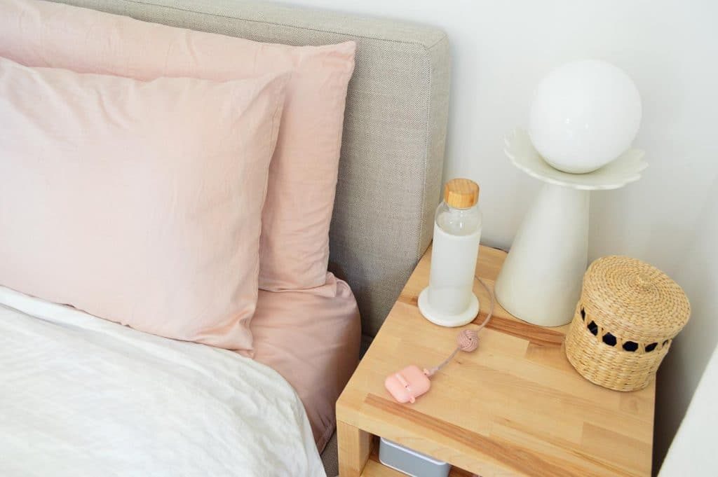 Overtop View Of Sherrys Hands-on Butcher Block Nightstand With Modern Lamp And Basket