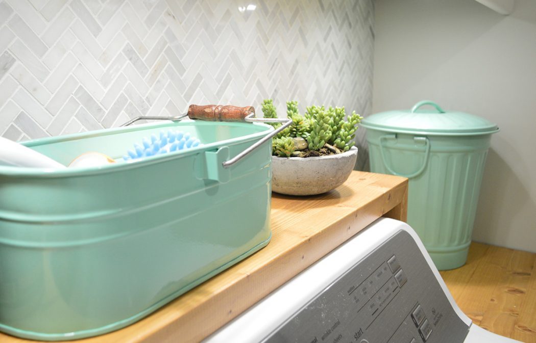 wood shelf over top loading washing machine in other laundry room