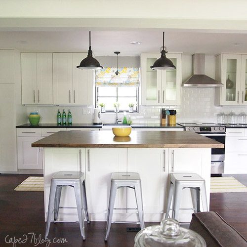 A White Kitchen Makeover Alongside White Tile & A Butcher Block Island