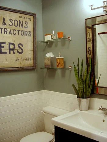 A Sage Green Bathroom Alongside Orange Accents