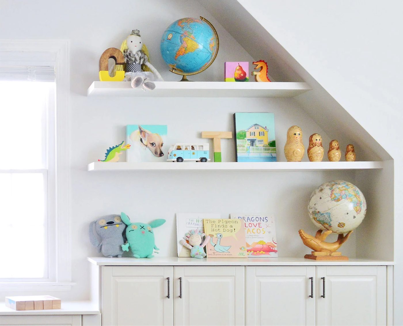 White Hands-on Floating Shelves In Playroom With Toys